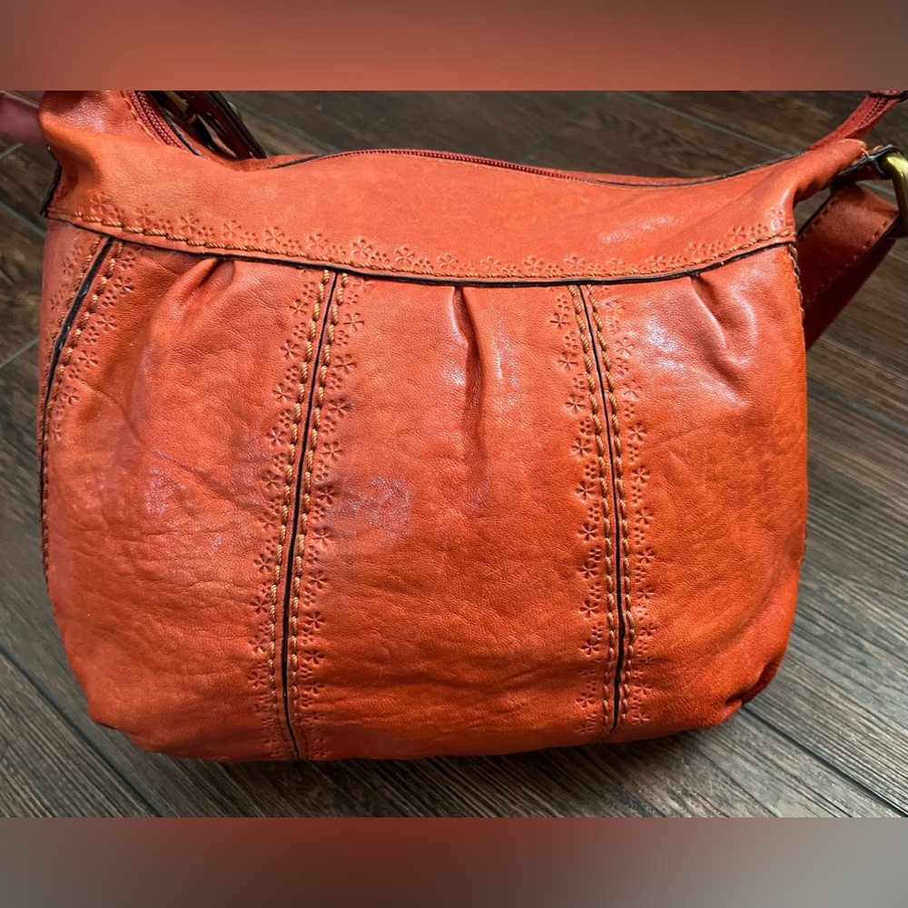 Fossil leather shoulder/crossbody bag.  Flower pattern pressed into the leather.